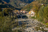 Fototapeta Perspektywa 3d - The beautiful village of Varallo, during fall season, in Valsesia (Sesia Valley). Province of Vercelli, Piedmont, Italy.