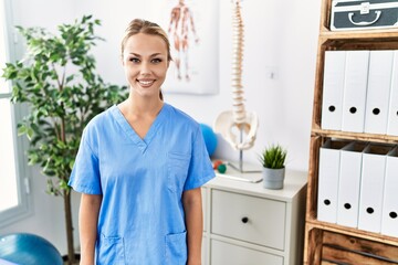 Sticker - Young caucasian woman working at pain recovery clinic with a happy and cool smile on face. lucky person.