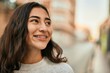 © Krakenimages.com - Young middle east girl smiling happy standing at the city.