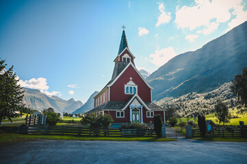 Olden Church in the village of Olden, Norway on a sunny summer day.