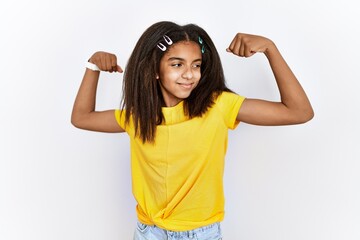 Sticker - Young african american girl standing over white isolated background showing arms muscles smiling proud. fitness concept.