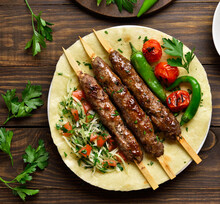 Turkish Adana Kebab With Fresh Vegetables On Flatbread