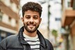 © Krakenimages.com - Young arab man smiling outdoor at the town