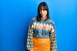 © Krakenimages.com - Young hispanic woman wearing casual winter sweater skeptic and nervous, frowning upset because of problem. negative person.