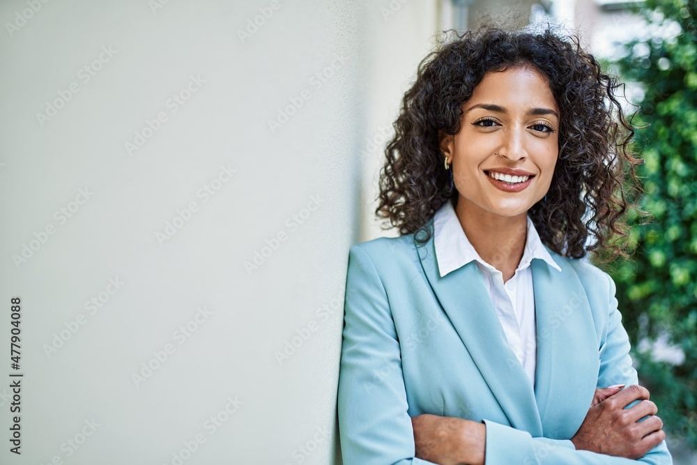 Young hispanic business woman wearing professional look smiling ...