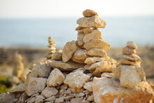 Cairn Of Stones In Desert Hills On Cyprus. Pyramid Of Rocks Marking The Trail For Hiking.