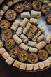 assorted circular tin of middle eastern baklava filo dough pastry sweets