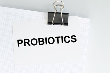 Wall Mural - PROBIOTICS - word written on card on clip attached to the blonde on the table