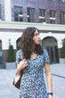 © zhukovvvlad - girl in a long dress on a city street