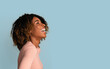 © Prostock-studio - Happy Emotions. Portrait Of Beautiful Laughing African American Woman Over Blue Background