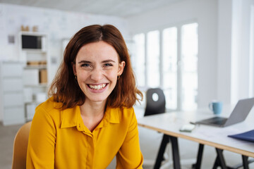 Happy smiling businesswoman with a lovely warm friendly smile