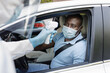 © Prostock-studio - Black man driver wearing protective face mask