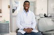 Leinwandbild Motiv Dental Services. Professional Black Male Stomatologist Posing At Workplace In Clinic Interior