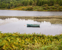 Fishing Boat On The Beautiful Small Loch Fina, Isle Of Mull, Scotland, UK