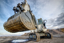 Big Excavator In Coal Mine At Cloudy Day, Low Angle View