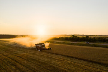 Aufkleber - Combine harvester on the field at sunset. Aerial view	