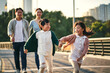 © imtmphoto - asian family with two children taking a walk in city park