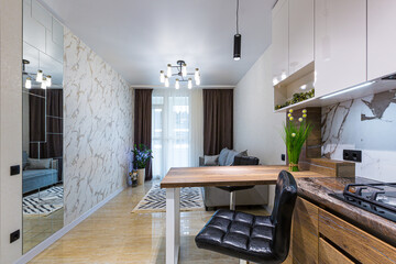 Modern wooden kitchen in a small apartment, apartment interior