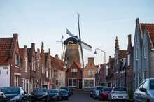 Walking In Old Dutch Town Zierikzee With Old Windmill, Small Houses And Streets