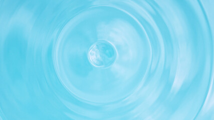 Wall Mural - Water splash isolated on light blue background, macro shot.