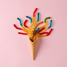 Ice Cream Cone With Gummy Candies On Pink Background.