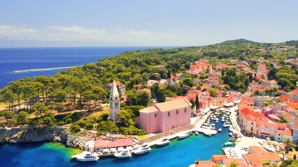 Fototapete - Shooting from a drone of the azure bay in town Veli Losinj on a sunny day. Croatia. Filmed in 4k, drone video.