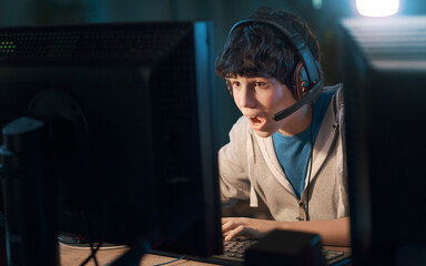 Young gamer playing online video games