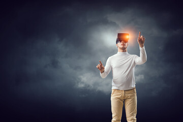 Wall Mural - man wearing virtual reality goggles