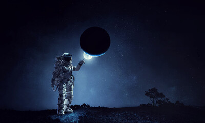 Wall Mural - astronaut walking on an unexplored planet