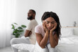 © Prostock-studio - Sad offended millennial african american wife ignores upset husband after quarrel on bed