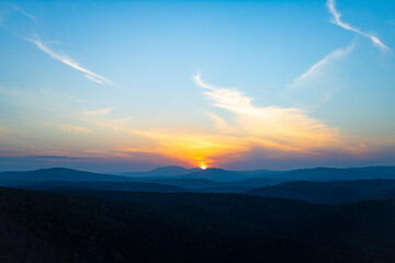 Wall Mural - Sunrise landscape of foggy and cloudy mountain top view