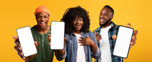 Three Excited Black People Showing Smartphones With White Blank Screen, Mockup