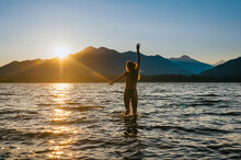 Female Swimming In Bikini During Sunset At Lake Wenatchee