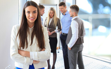 Wall Mural - Face of beautiful woman on the background of business people