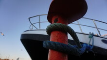Close Up Of Mooring With Rope And Boat