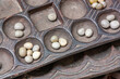 Boa Mancala tradition African Board Game With natural baobab tree seeds Balls. Stone Town Zanzibar, Tanzania. Mancala is a game which is very popular in Africa and Arabs