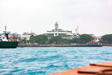 Fototapeta Tulipany - View on Palace Museum from water Stone Town Zanzibar