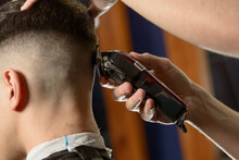 Close Up Of Hair Clipper. Person Getting A Haircut