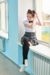 © Roman Akimov - high school student is sitting on the windowsill. Anime style