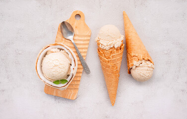 Fototapete - Coconut ice cream flavours in half of coconut setup on white stone background. Summer and Sweet menu concept.