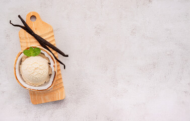 Fototapete - Coconut ice cream flavours in half of coconut setup on white stone background. Summer and Sweet menu concept.
