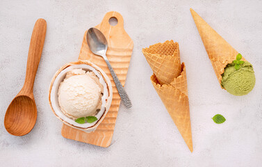 Fototapete - Coconut ice cream flavours in half of coconut setup on white stone background. Summer and Sweet menu concept.