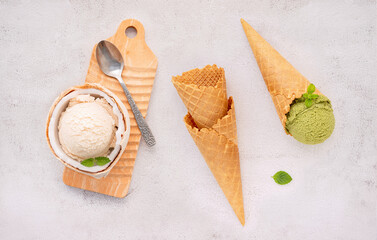 Fototapete - Coconut ice cream flavours in half of coconut setup on white stone background. Summer and Sweet menu concept.
