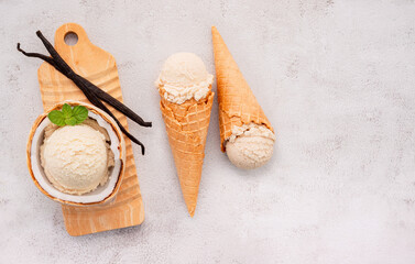 Fototapete - Coconut ice cream flavours in half of coconut setup on white stone background. Summer and Sweet menu concept.
