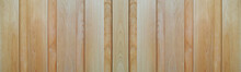 白木調の木の板塀のテクスチャー。横に長いパノラマの背景素材。