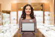 © Syda Productions - sale, shopping and business concept - happy female shop assistant with tablet pc computer name tag over jewelry store background