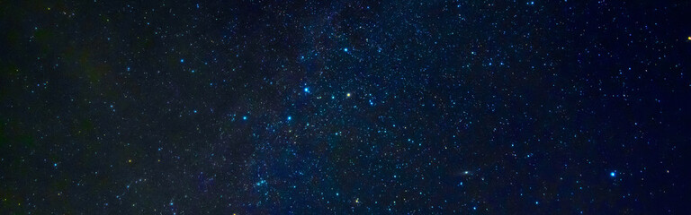 Wall Mural - Panorama of the starry sky at night on a dark blue background with many stars and galaxies