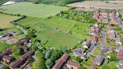 Canvas Print - Aerial footage of the town centre of the village of Ossett in Wakefield west Yorkshire UK, showing the British residential houses, road and streets from above on a sunny summers day.