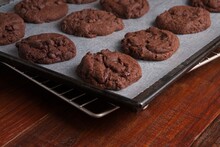 Triple Chocolate Chip Cookies On A Backing Sheet
