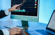 © DisobeyArt - Trader woman studying stock market at bank office - Focus on top hand